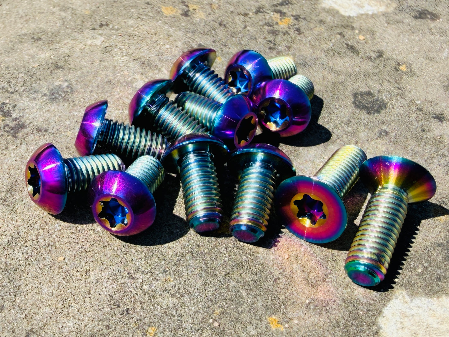 oil slick rainbow titanium disc bolt kit for Specialized Levo and Kenevo models that feature a rear wheel speed sensor magnet