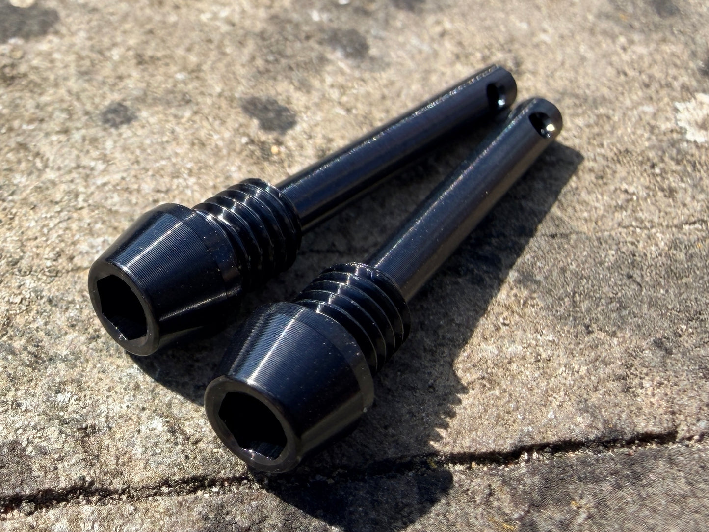 black Hope brake pad retention pins in CNC machined titanium
