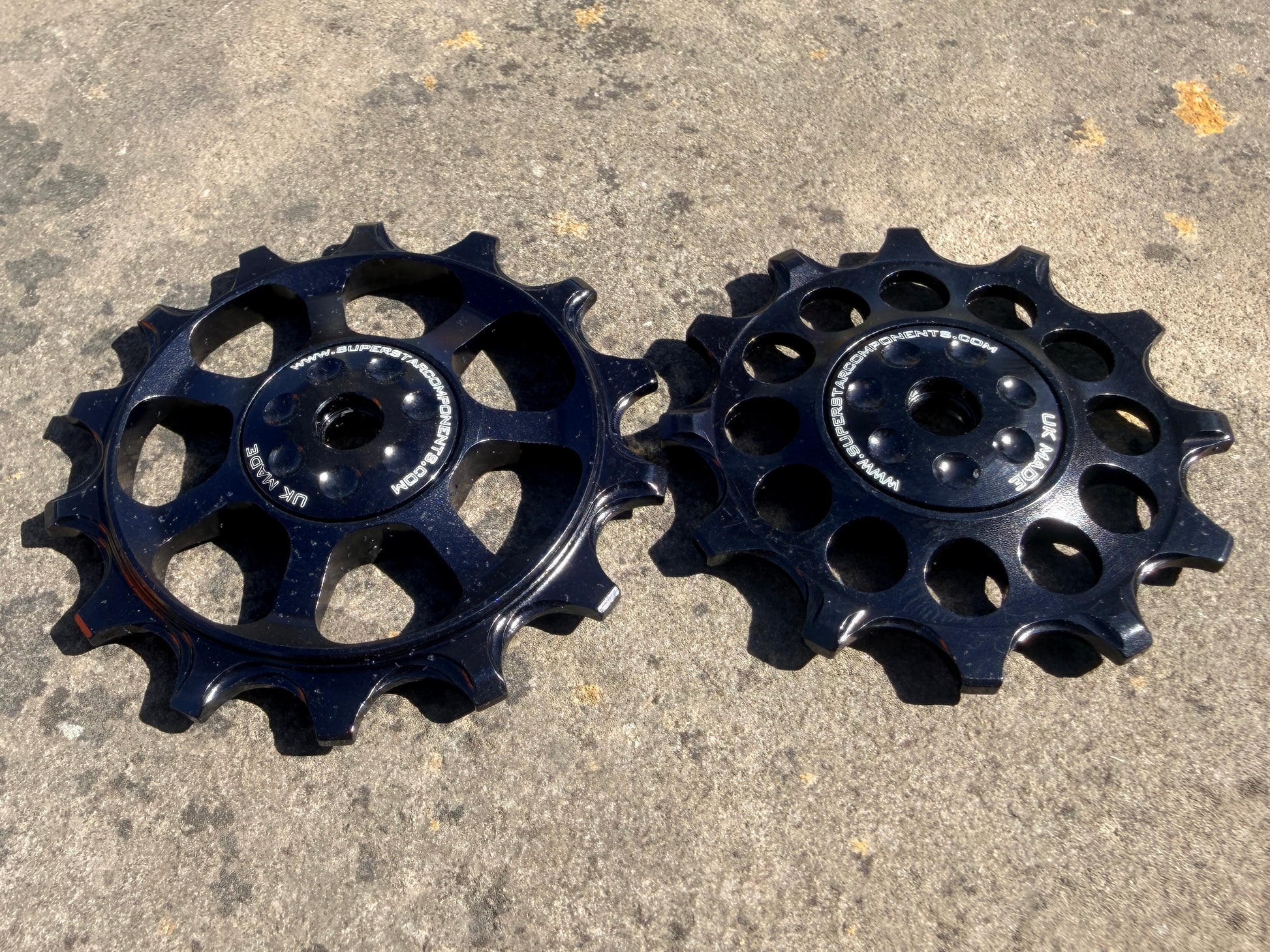 A pair of black jockey wheels with sealed bearings, designed for use with SRAM EAGLE NX rear derailleurs.