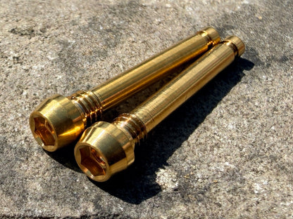 Gold Magura brake pad retention pins in cnc machined titanium