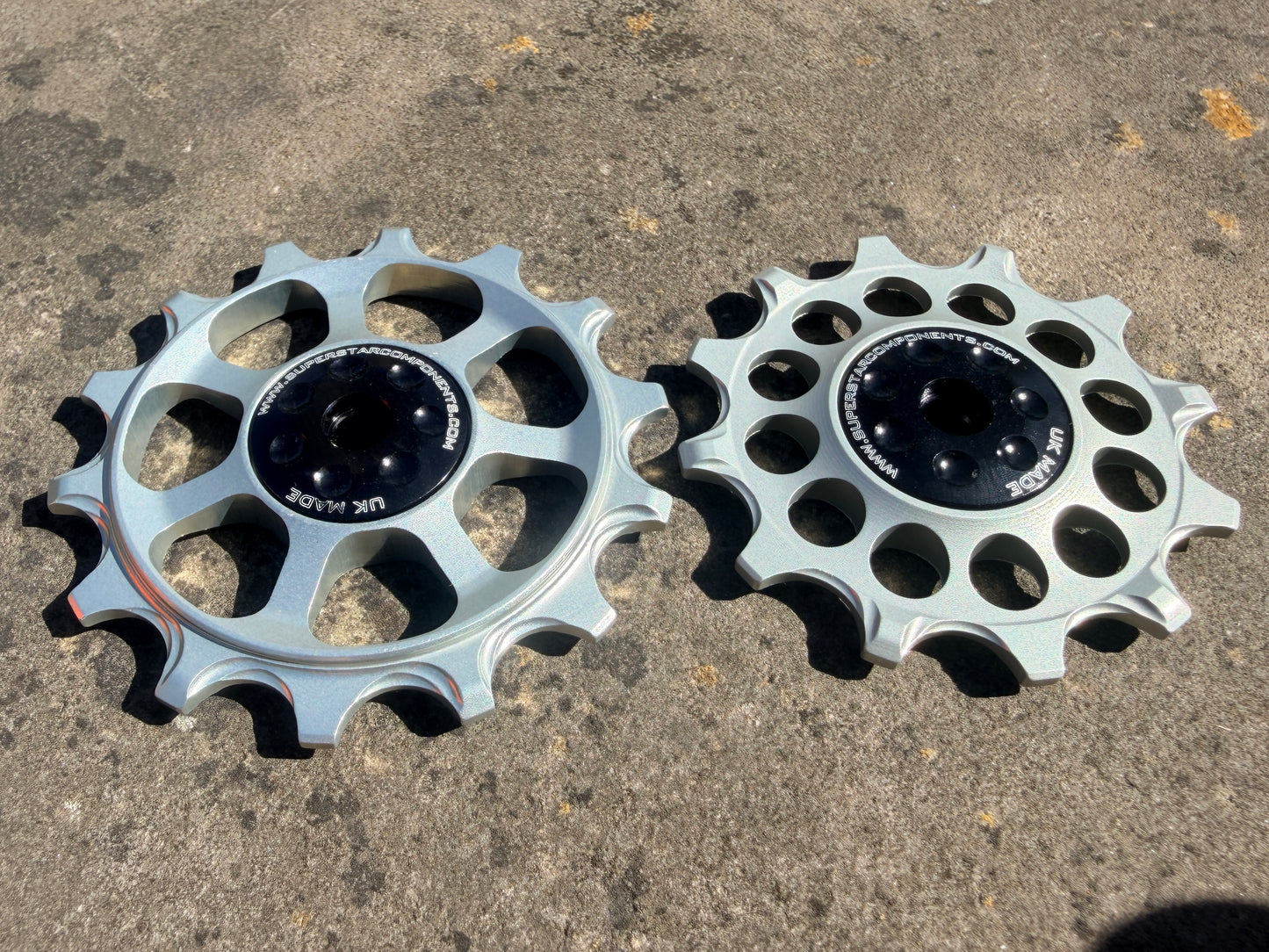 A pair of silver jockey wheels with sealed bearings, designed for use with SRAM EAGLE X01 rear derailleurs.