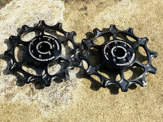 black 12T Titanium jockey wheels with sealed bearings, designed for use with SRAM rear derailleurs.