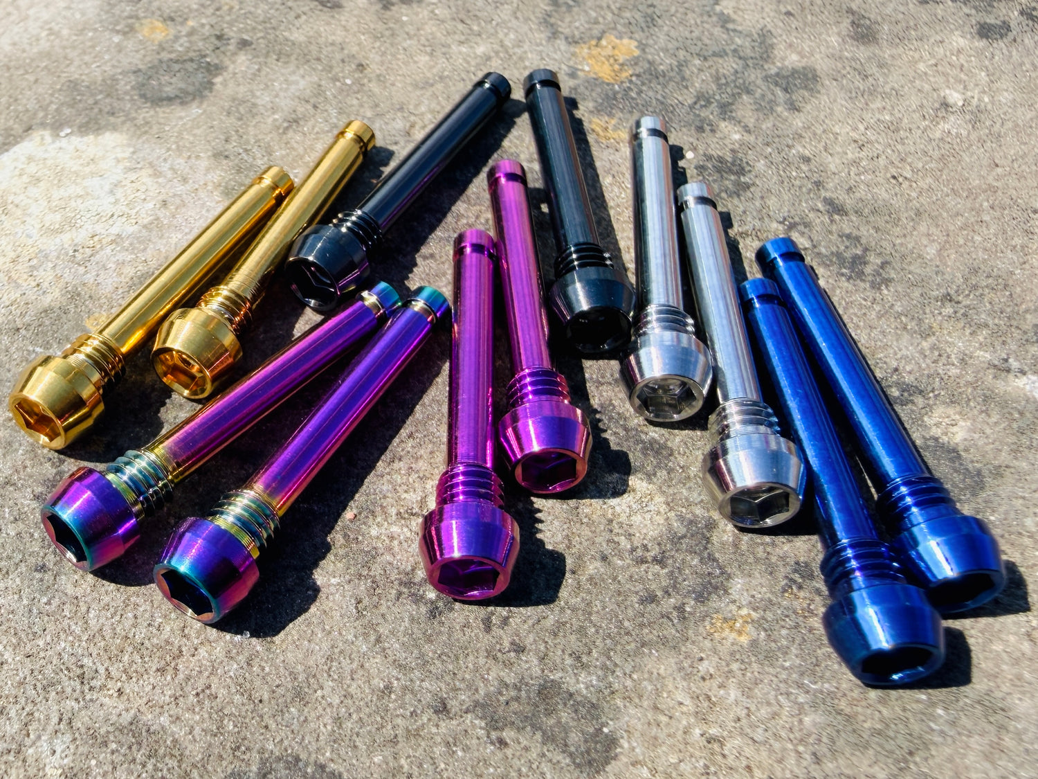 Colourful Shimano brake pad retention pins in cnc machined titanium