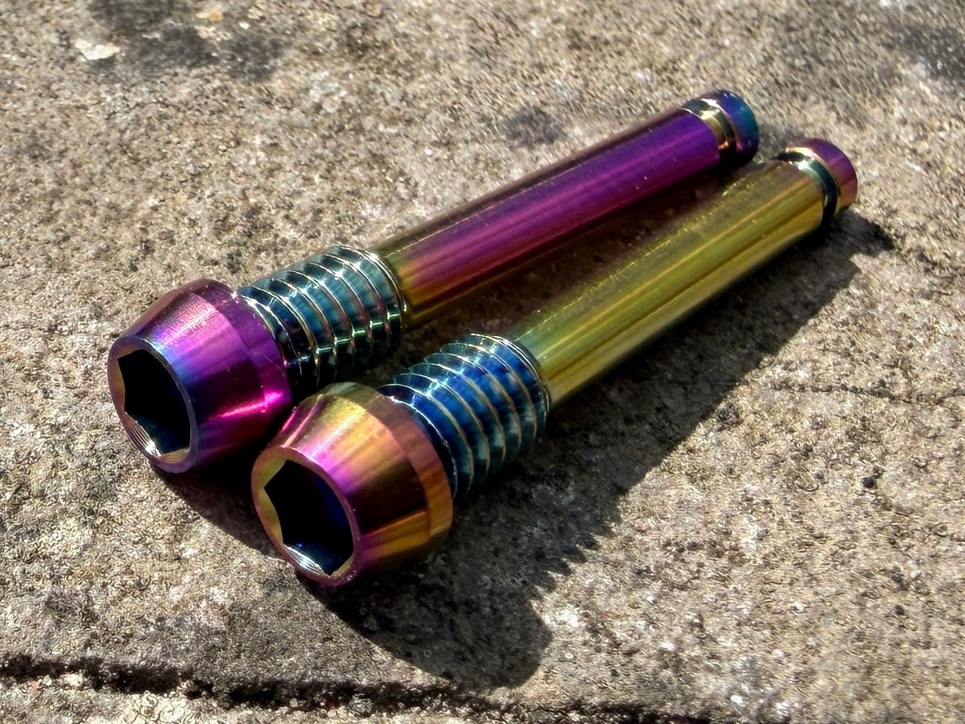 rainbow SRAM brake pad retention pins in CNC machined titanium