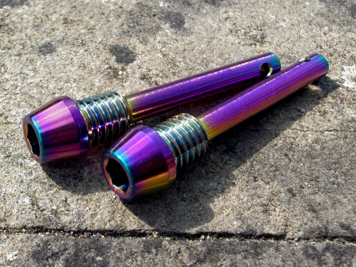 rainbow Hope brake pad retention pins in CNC machined titanium