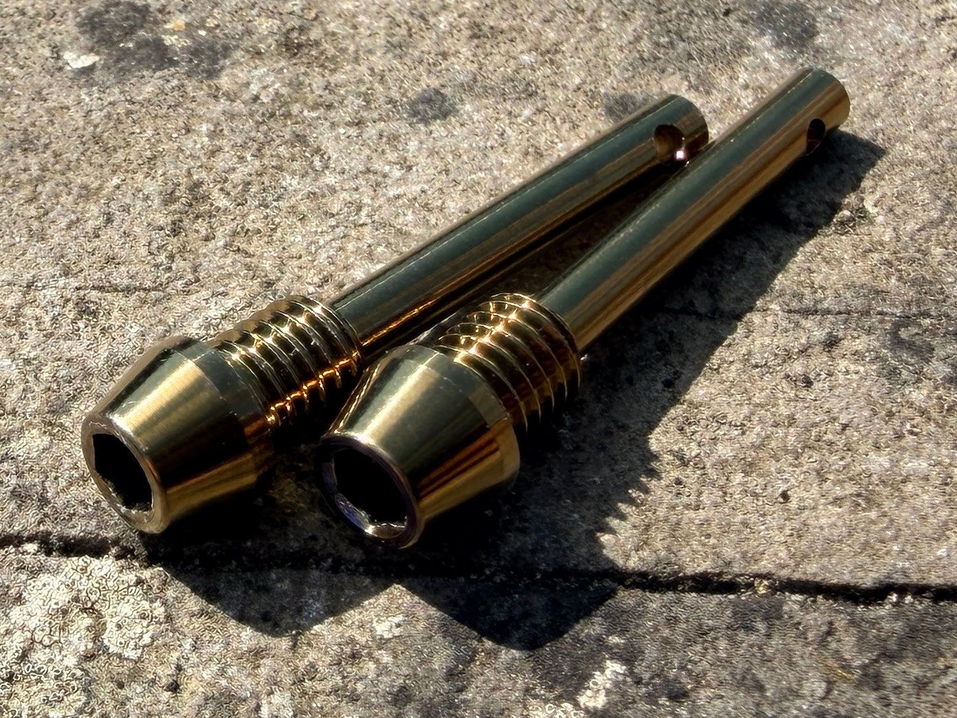 bronze Hope brake pad retention pins in CNC machined titanium