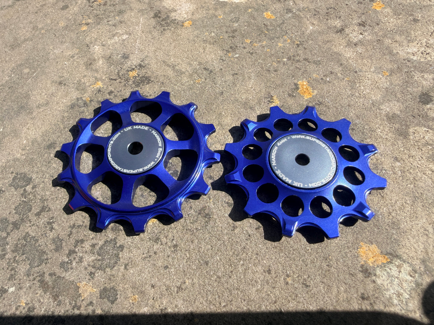 A pair of blue jockey wheels with sealed bearings, designed for use with SRAM AXS rear derailleurs.