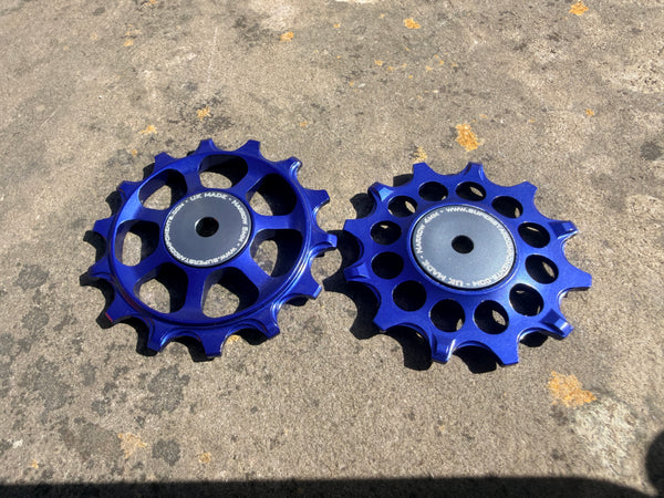 A pair of blue jockey wheels with sealed bearings, designed for use with SRAM AXS rear derailleurs.