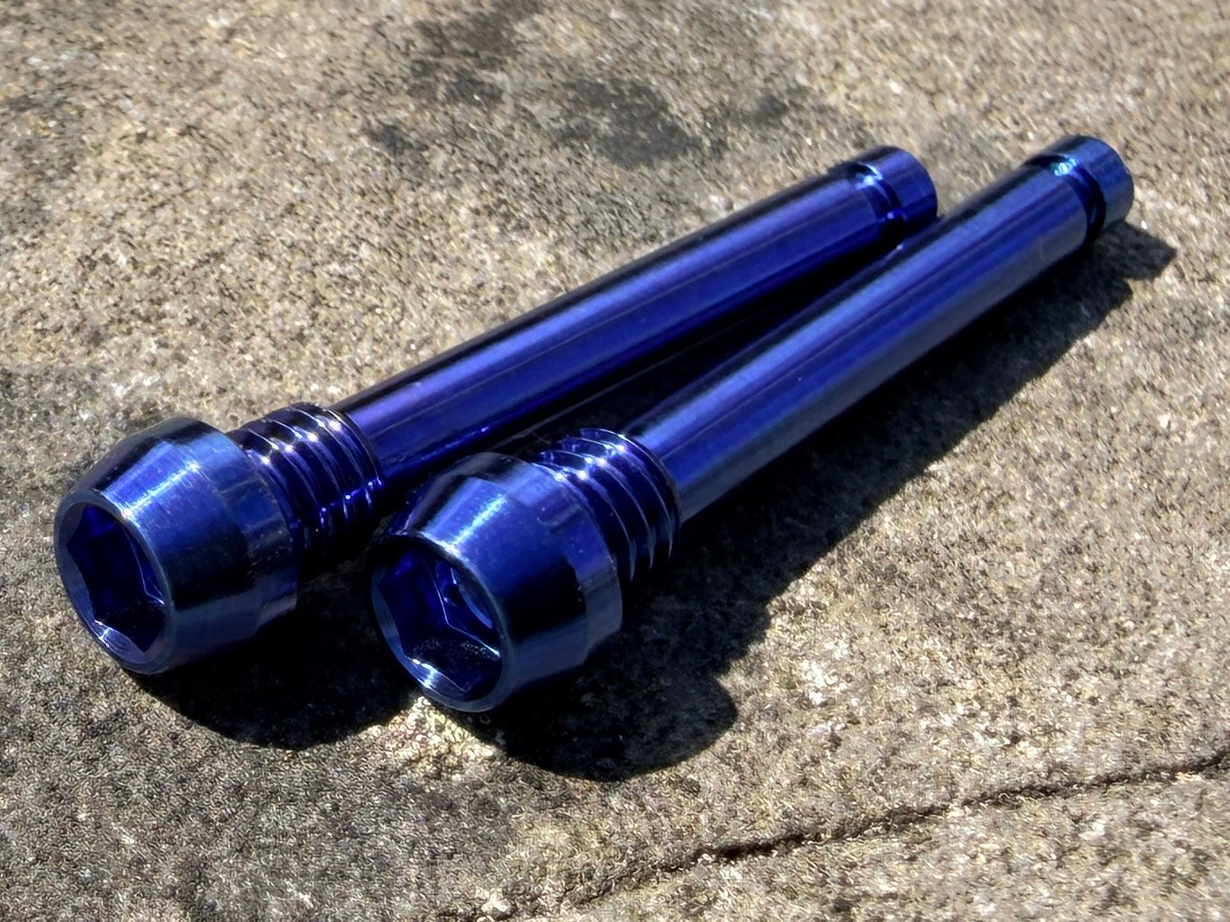 BlueMagura brake pad retention pins in cnc machined titanium