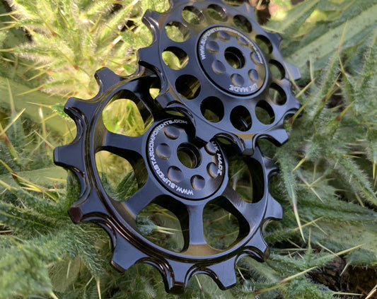 A pair of black jockey wheels with visible bearing shields, designed for use with SRAM EAGLE rear derailleurs.